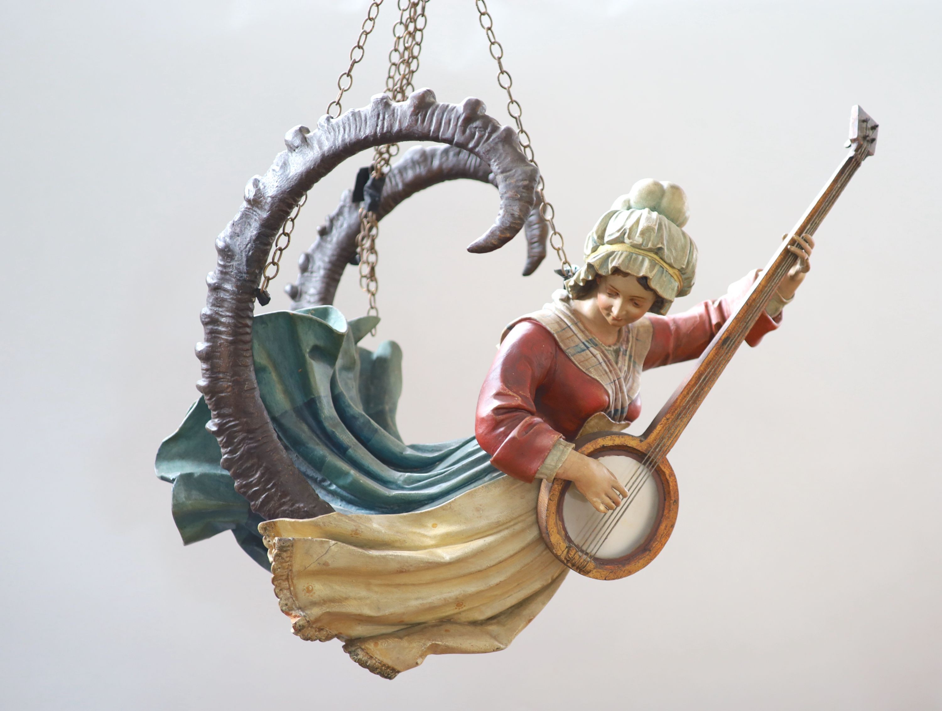 A late 19th century carved and painted wood Lusterweibchen H 60cm. W 80cm.